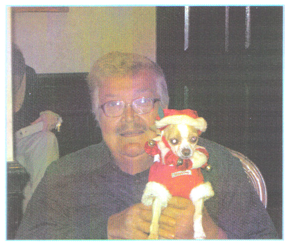 Christmas-2011, A PICTURE OF ME HOLDING MY FAVORITE DOG A CHIHUAHUA 
DRESSED UP AS SANTA'S HELPER.